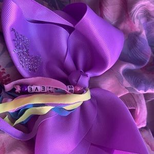 Purple jojo siwa bow with streamers